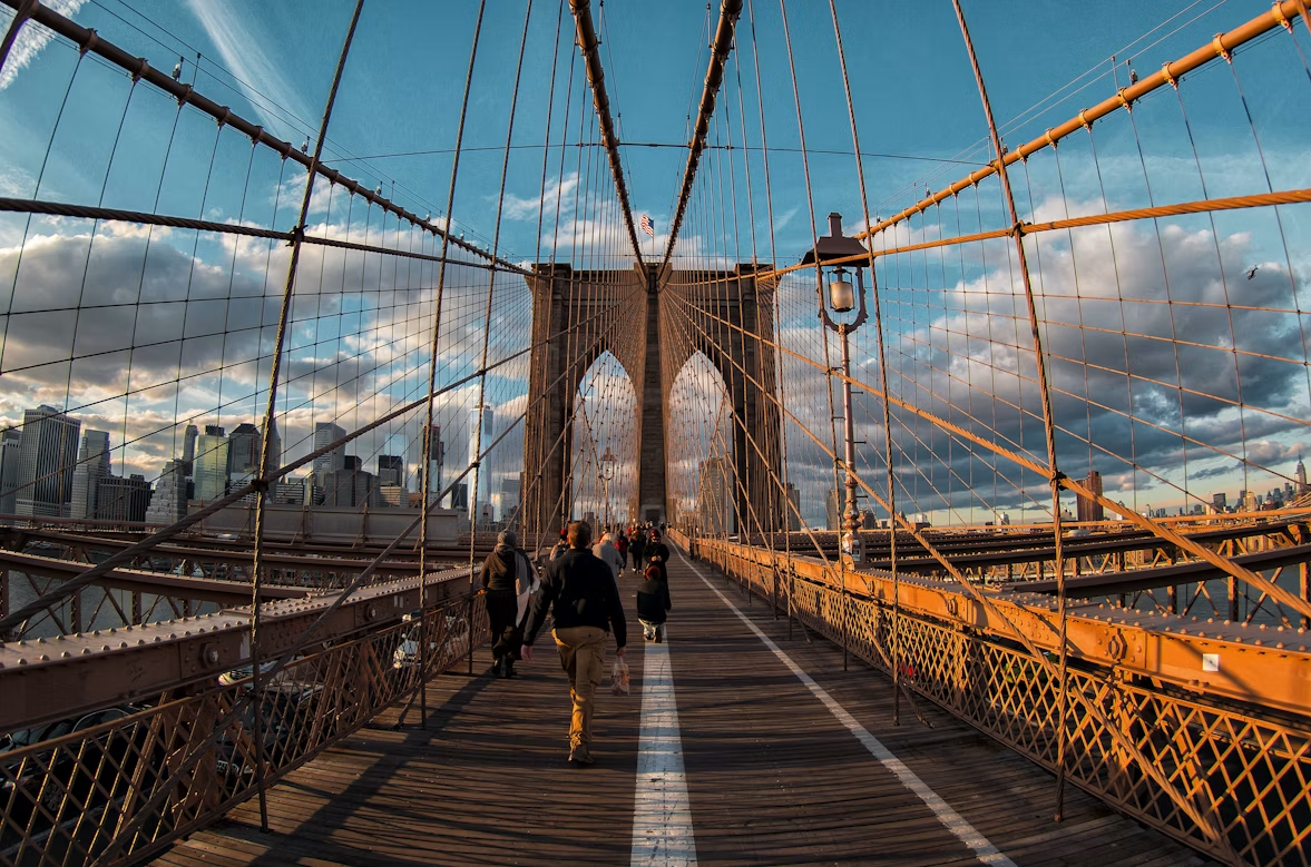 Walking across the Brooklyn Bridge at golden hour